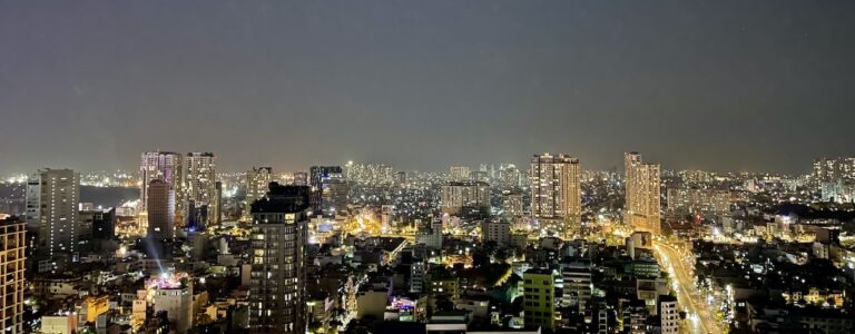 Ho Chi Minh City skyline at night, seen from a high floor